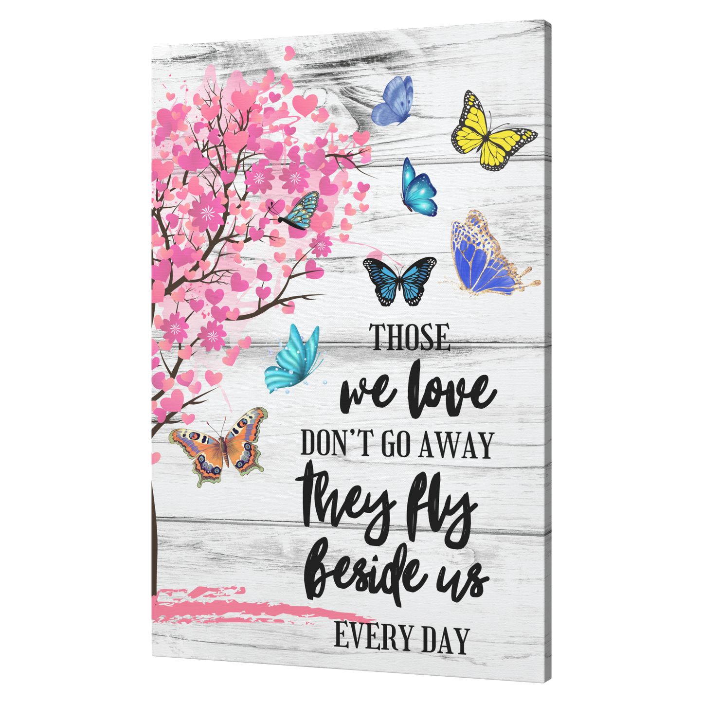 Memorial canvas with pink heart tree, colorful butterflies, and comforting black script text on white wood background.
