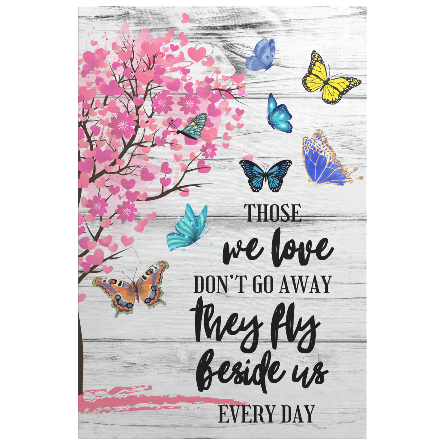 Memorial canvas wall art with pink heart-shaped tree and colorful butterflies on whitewashed wood background, comforting.