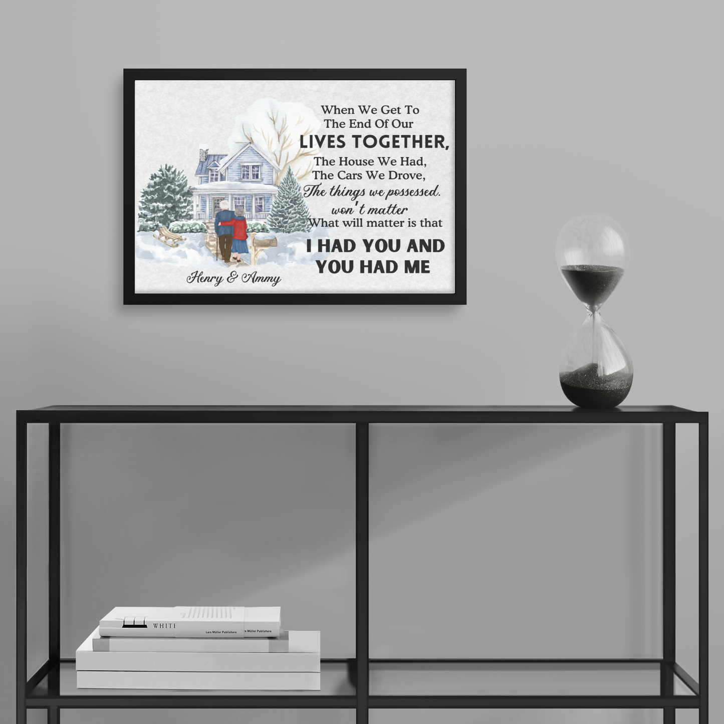 Black framed custom wall art with a house, trees, and personalized anniversary poem above a couple's names.
