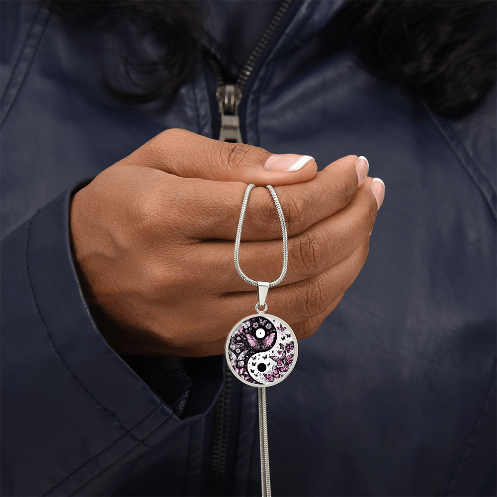 Silver necklace with yin yang pendant featuring violet butterflies and intricate detailing.