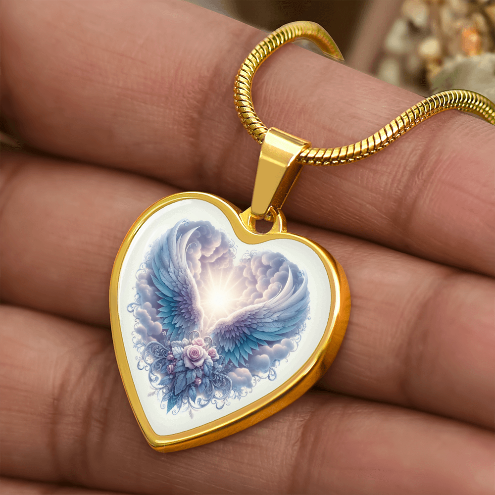 Gold heart-shaped pendant necklace with angel wings and floral graphic design.