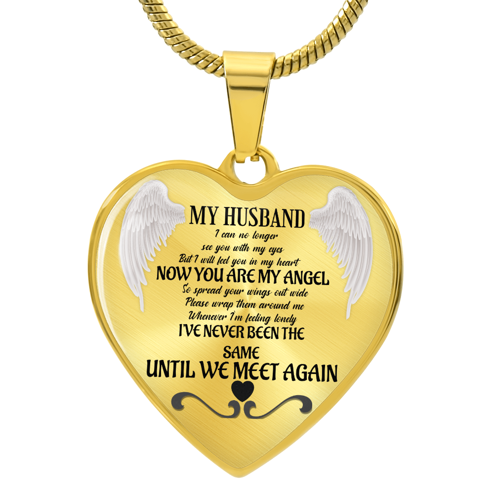 Gold heart-shaped pendant engraved with memorial poem and angel wings on a gold chain.