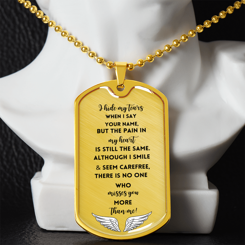 Gold military dog tag necklace engraved with memorial poem and angel wings detail.