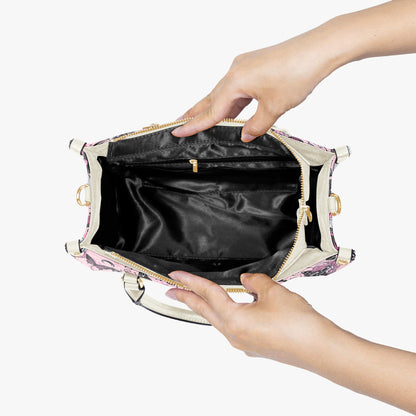 Handbag with floral pattern held open by a hand on a white background