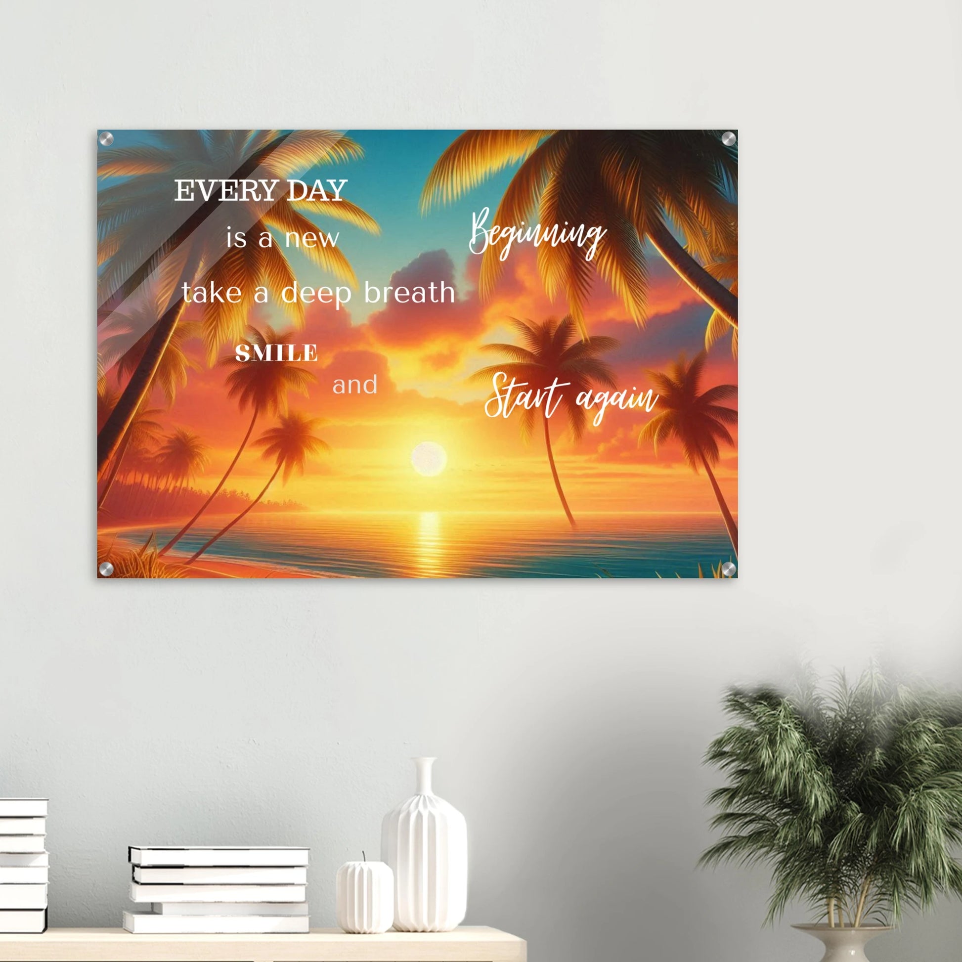 Motivational poster with palm trees and sunset over a beach, featuring inspirational text on a white wall.