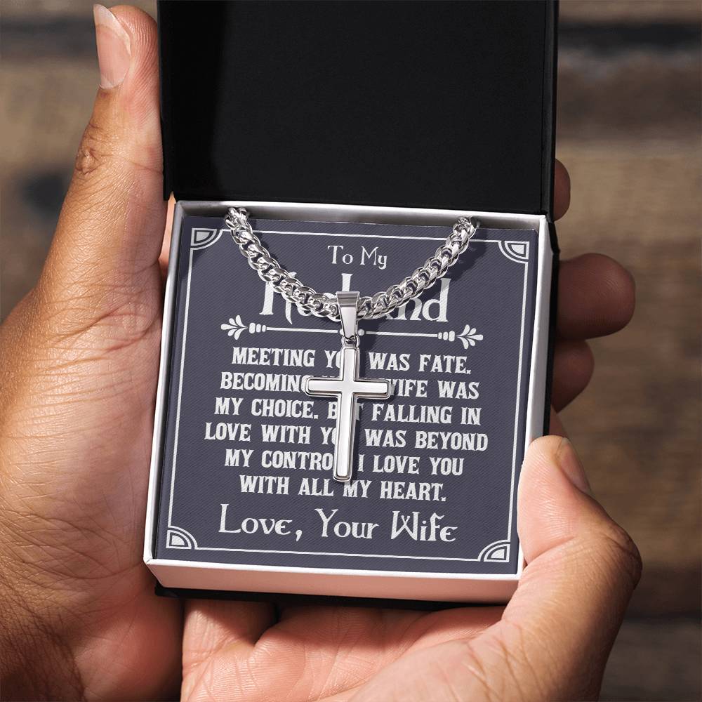 Hands holding open gift box with silver cross necklace on Cuban chain and heartfelt message card to husband from wife, showcasing personalized jewelry gift