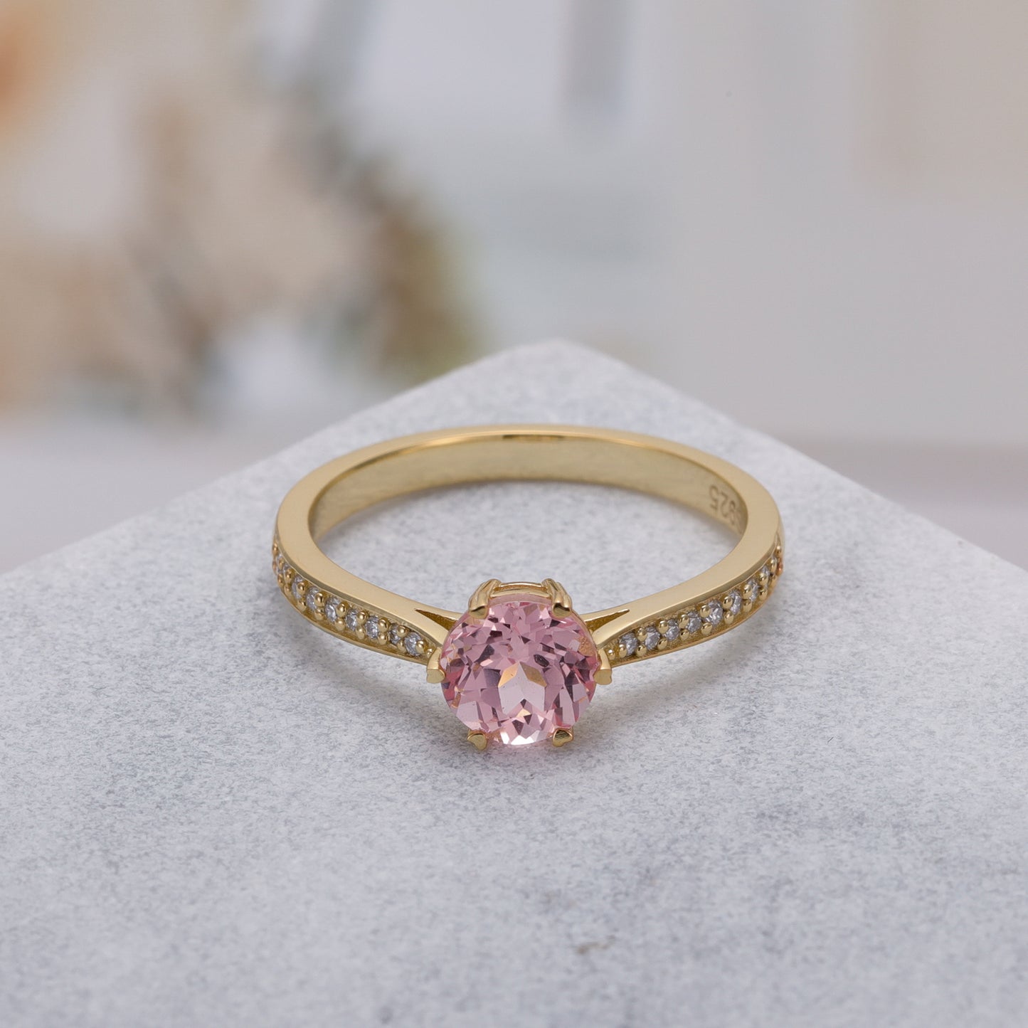 925 Sterling Silver Lab Pink Sapphire Ring with gold-plated band and round pink sapphire gemstone centerpiece.
