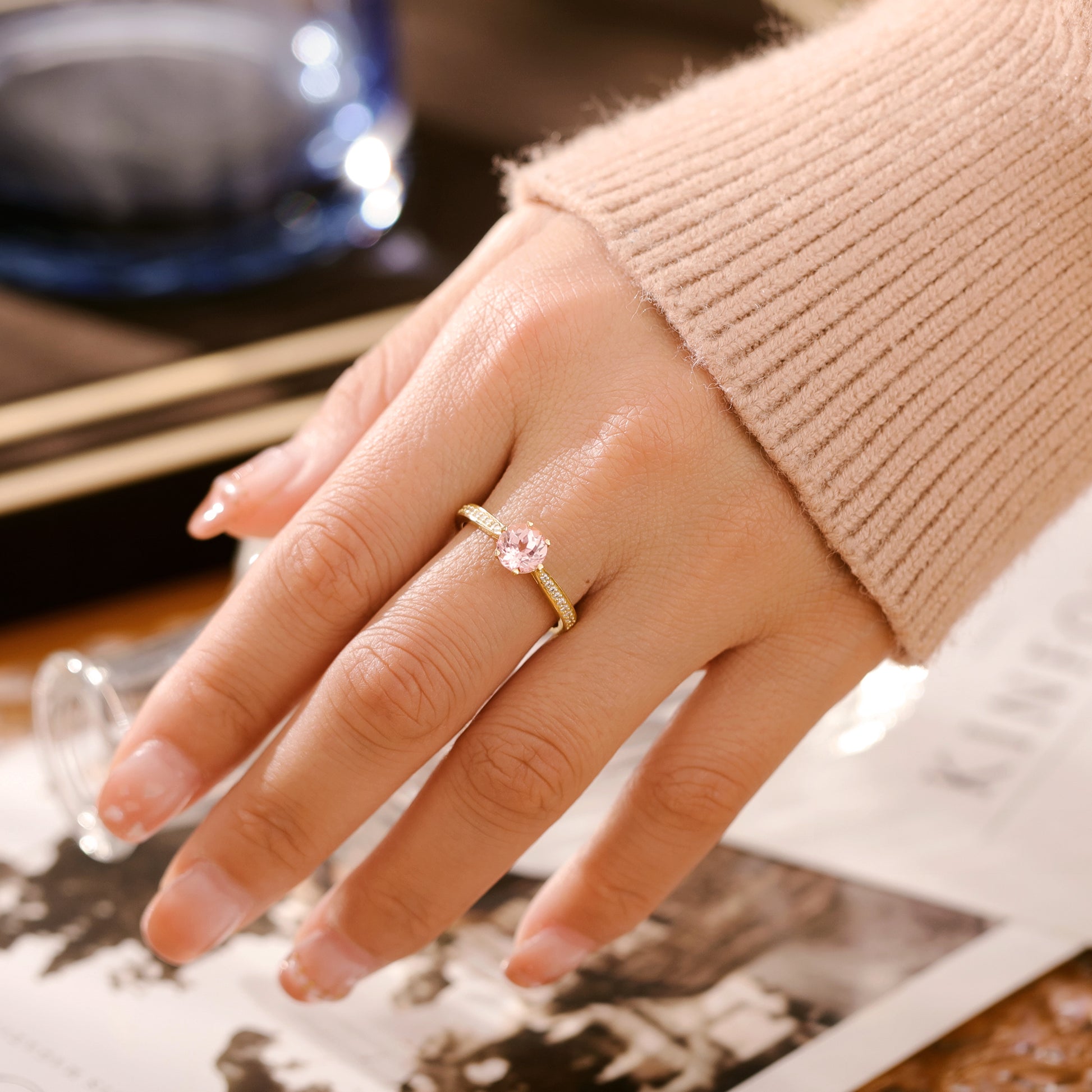 925 Sterling Silver Lab Pink Sapphire Ring with round pink gemstone on gold plated band worn on hand