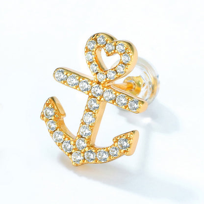 Gold-plated sterling silver earring featuring a ship's anchor design with a heart-shaped top, adorned with sparkling cubic zirconia stones, showcasing nautical elegance and intricate craftsmanship