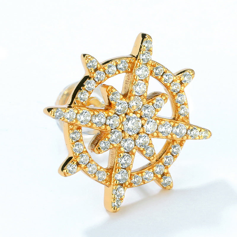 Gold-plated sterling silver ship's wheel earring featuring intricate diamond-studded design, showcasing nautical charm and luxury in a compact, elegant form.